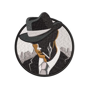 May include: A black and white embroidered patch of a man wearing a black fedora and a suit, smoking a cigarette. The background is a cityscape.