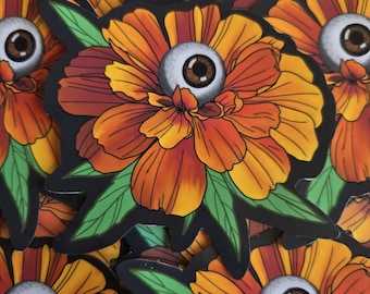 Pegatina de flor con ojo de caléndula en flor vigilante