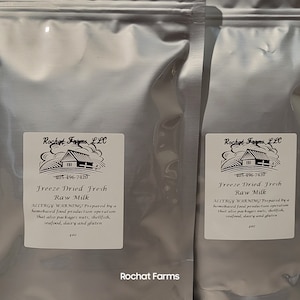 May include: A collection of silver pouches containing freeze-dried raw milk from Rochat Farms. Each pouch features a white label with the Rochat Farms logo, product details, and a warning. The pouches are sealed and filled with a powdered substance.