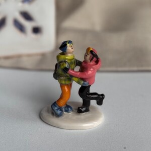 Custom family figurine crafted from photos, ceramic miniature with unique details