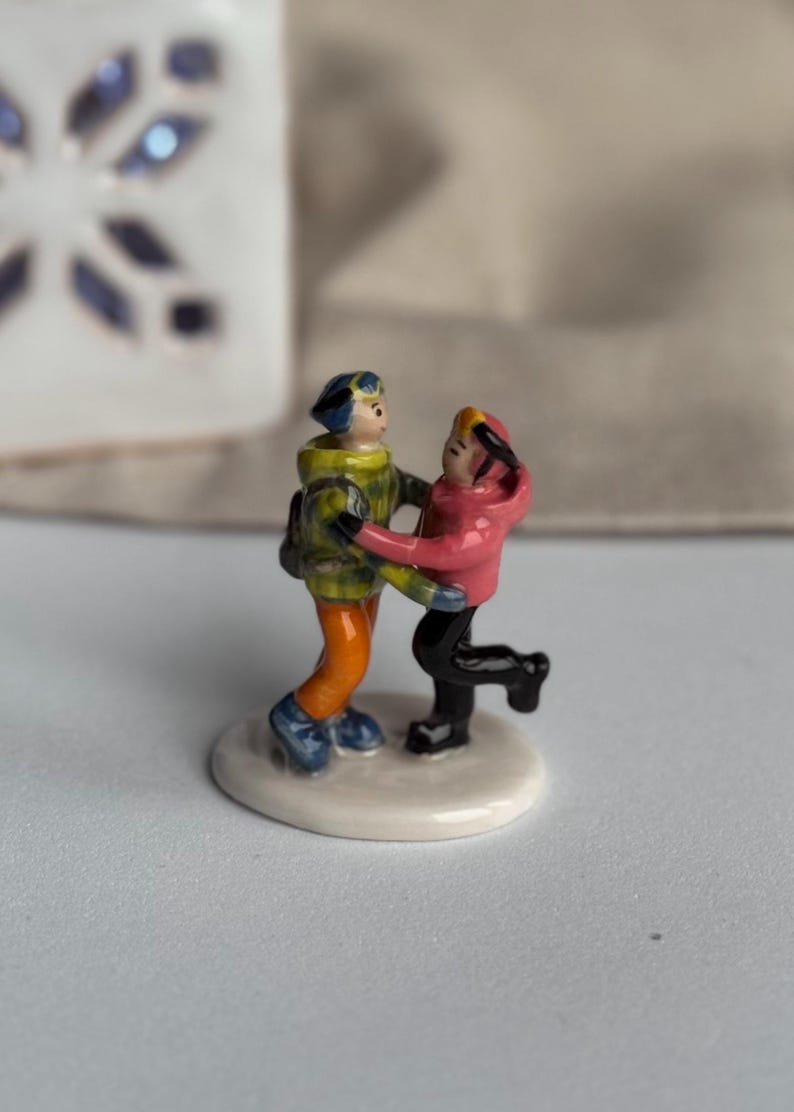 Custom family figurine crafted from photos, ceramic miniature with unique details
