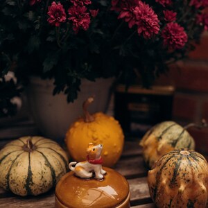Fall season decorative ceramic box with cute dog figurine topper, warm honey-colored crackle finish lid and deep blue glossy body, perfect pet lover gift for Black Friday Cyber Monday shopping