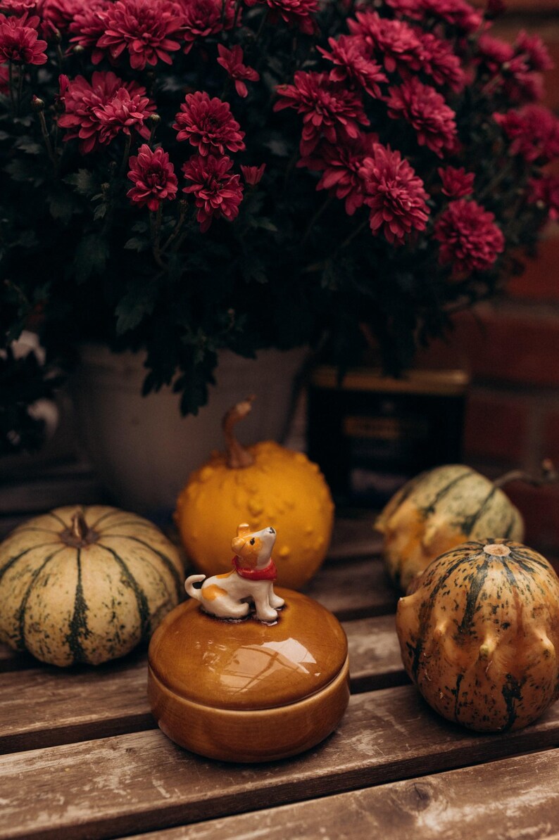 Fall season decorative ceramic box with cute dog figurine topper, warm honey-colored crackle finish lid and deep blue glossy body, perfect pet lover gift for Black Friday Cyber Monday shopping