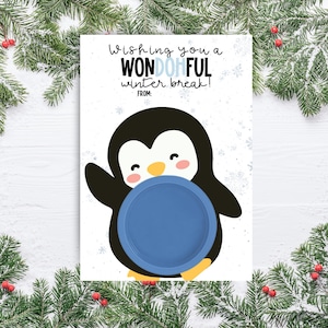 May include: A greeting card featuring a cartoon penguin holding a blue plate. The card has the text "Wishing you a WONDERFUL winter break!" and "FROM:" on a white background with snowflakes. The card is decorated with pine branches.
