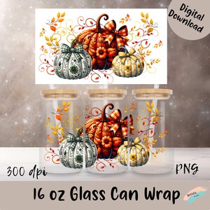 May include: Three 16 oz glass can wraps featuring a fall-themed design with pumpkins, leaves, and swirls. The pumpkins are in shades of orange, green, and white with a plaid pattern. The design is 300 dpi and in PNG format.