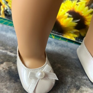 While shoes for American girl doll 18” 3 different styles on the top of shoes.
