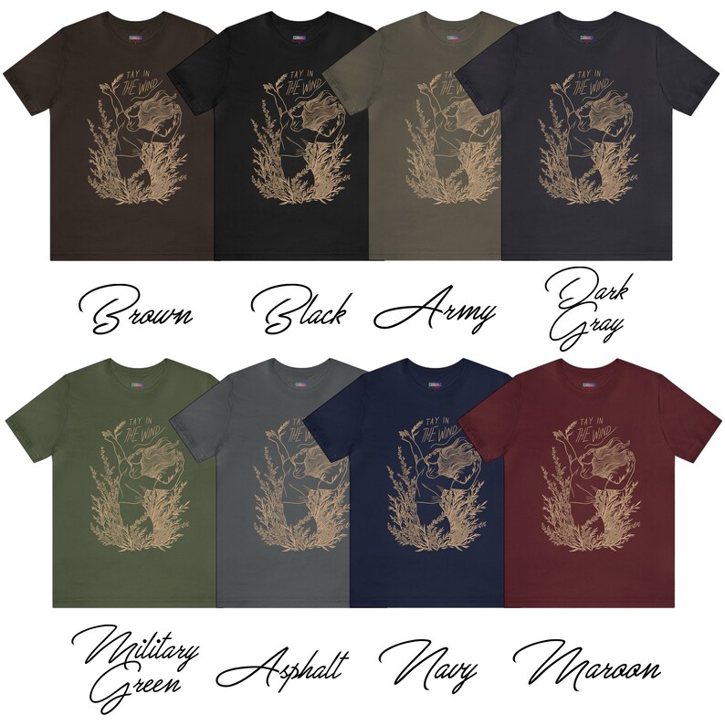 May include: A collection of eight short-sleeve t-shirts in brown, black, army green, dark gray, military green, asphalt, navy, and maroon. Each shirt features a tan line-art graphic of a person with flowing hair and the text Tay in the Wind.