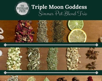May include: Triple Moon Goddess Simmer Pot Blend Trio, a collection of dried herbs and spices arranged in three rows on a wooden surface. The herbs include rose petals, lavender, rosemary, jasmine, ginger, star anise, bay leaves, cloves, and black peppercorns.