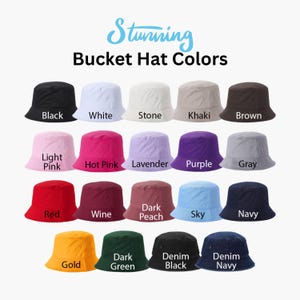 May include: A chart showing 18 different colors of bucket hats. The colors include black, white, stone, khaki, brown, light pink, hot pink, lavender, purple, gray, red, wine, dark peach, sky, navy, gold, dark green, denim black, and denim navy.