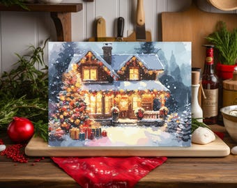 May include: A framed painting of a snow-covered house decorated for Christmas. The house has lit windows, a decorated Christmas tree, and wrapped gifts. The painting is displayed on a wooden surface with a red cloth.