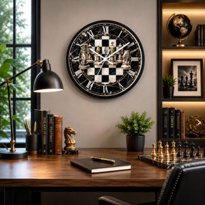May include: A round wall clock featuring a black and white marble background with a central chessboard pattern and gold-toned chess pieces. The clock face displays white Roman numerals and thin white hands, set against a dark circular frame.