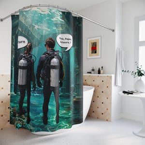 May include: A digitally printed shower curtain depicting an underwater scene with two scuba divers. Speech bubbles say "turn" and "Rock, Paper, Scissors..?" The curtain has a teal and green colour scheme, with a white background.