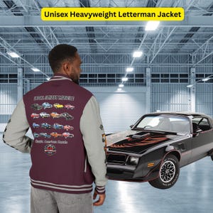 May include: A burgundy and gray unisex heavyweight letterman jacket with the text "Legal Street Muscle" and images of classic American muscle cars. A black sports car is parked nearby.