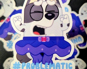 May include: A white and gray cartoon dog wearing a purple and blue tutu with a pink bow. The dog is standing on its hind legs with its arms raised in the air. The text "#PROBLEMATIC" is written below the dog.