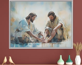 May include: A painting of two men in white robes, one washing the other's feet. The painting is framed in a silver frame and hangs on a red wall.