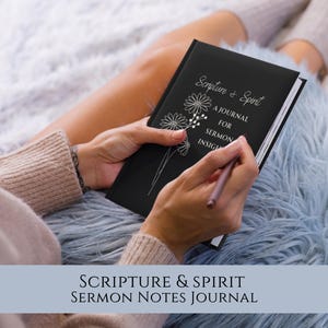 May include: A black journal with the text "Scripture & Spirit A Journal for Sermon Insight" and a floral design. The journal is open and a person is writing in it with a pen.