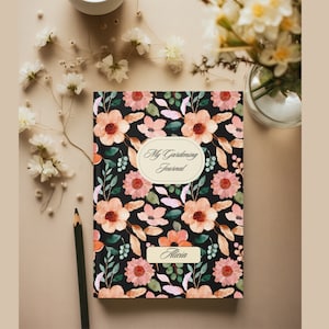 May include: A black journal with a floral pattern in shades of pink, orange, and green. The text "My Gardening Journal" is printed on the cover, along with the name "Alicia".
