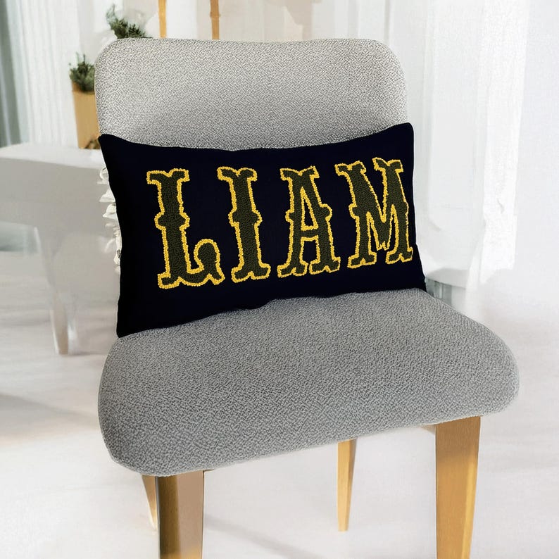 Bohemian home decor accent pillow with punch needle embroidered Liam lettering, ideal for new home styling or thoughtful new mom gifts.