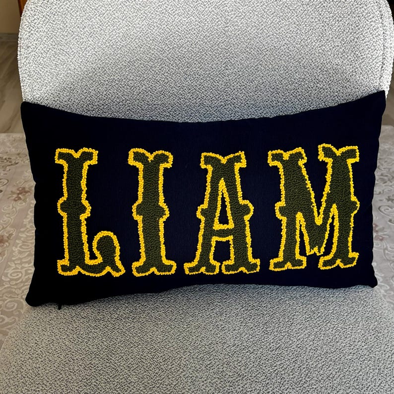 Bohemian home decor accent pillow with punch needle embroidered Liam lettering, ideal for new home styling or thoughtful new mom gifts.