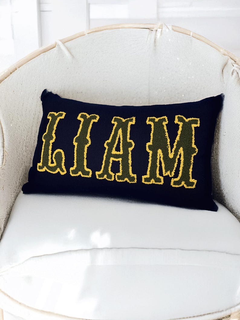 Bohemian home decor accent pillow with punch needle embroidered Liam lettering, ideal for new home styling or thoughtful new mom gifts.