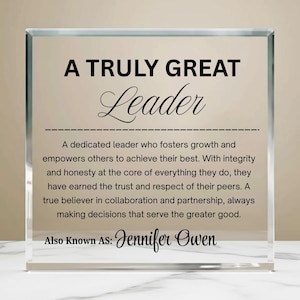 May include: A clear glass block with the words "A Truly Great Leader" in black. The text below describes leadership qualities, with "Jennifer Owen" as the name. A thoughtful gift for a leader.