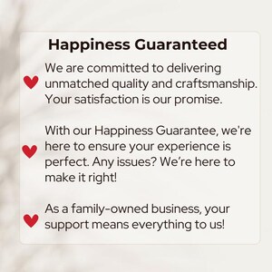 May include: A white rectangular graphic with the text "Happiness Guaranteed" in a bold, black font. The text below details a commitment to quality and satisfaction, with red heart icons. The graphic promises to make things right.