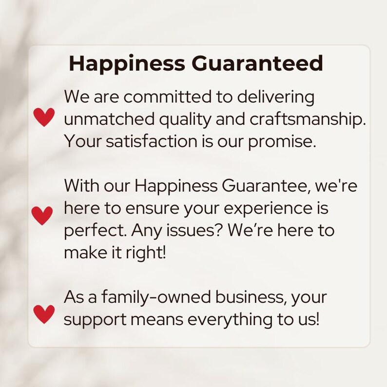 May include: A white rectangular graphic with the text "Happiness Guaranteed" in a bold, black font. The text below details a commitment to quality and satisfaction, with red heart icons. The graphic promises to make things right.