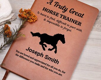 May include: A brown leather journal with the text "A Truly Great HORSE TRAINER" and a black silhouette of a horse. The journal also includes the name "Joseph Smith" and a personalized message.