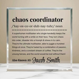 May include: A clear glass block featuring the words "chaos coordinator" in black, along with a definition and the name "Jacob Smith". A thoughtful gift for a friend or family member.