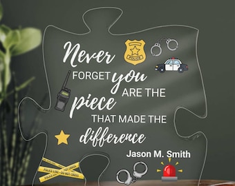 May include: Clear acrylic puzzle piece with the text "Never forget you are the piece that made the difference." Includes police badge, handcuffs, police car, star, and police tape graphics. Signed "Jason M. Smith".