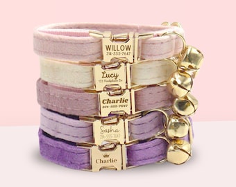 May include: A stack of five colorful velvet cat collars with gold-tone engraved name tags and bells. The collars are in shades of pink, cream, lavender, and purple. The name tags include the names "Willow", "Lucy", "Charlie", "Sasha", and "Charlie".