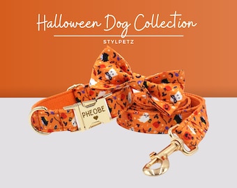 May include: Orange and black Halloween dog collar and leash set with a matching bow tie. The collar has a gold buckle with the name "Pheobe" engraved on it. The set features a cute Halloween print with ghosts, pumpkins, and bats.