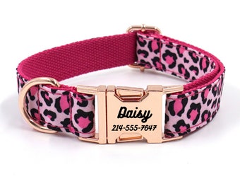 May include: Pink and black leopard print dog collar with a rose gold buckle and a personalized name tag that reads "Daisy" and a phone number.