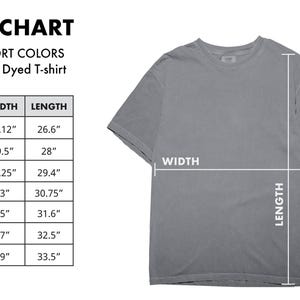 May include: A gray Comfort Colors garment-dyed t-shirt with a size chart. The chart lists sizes S to 4XL, with corresponding width and length measurements in inches. The shirt is displayed with width and length indicators.