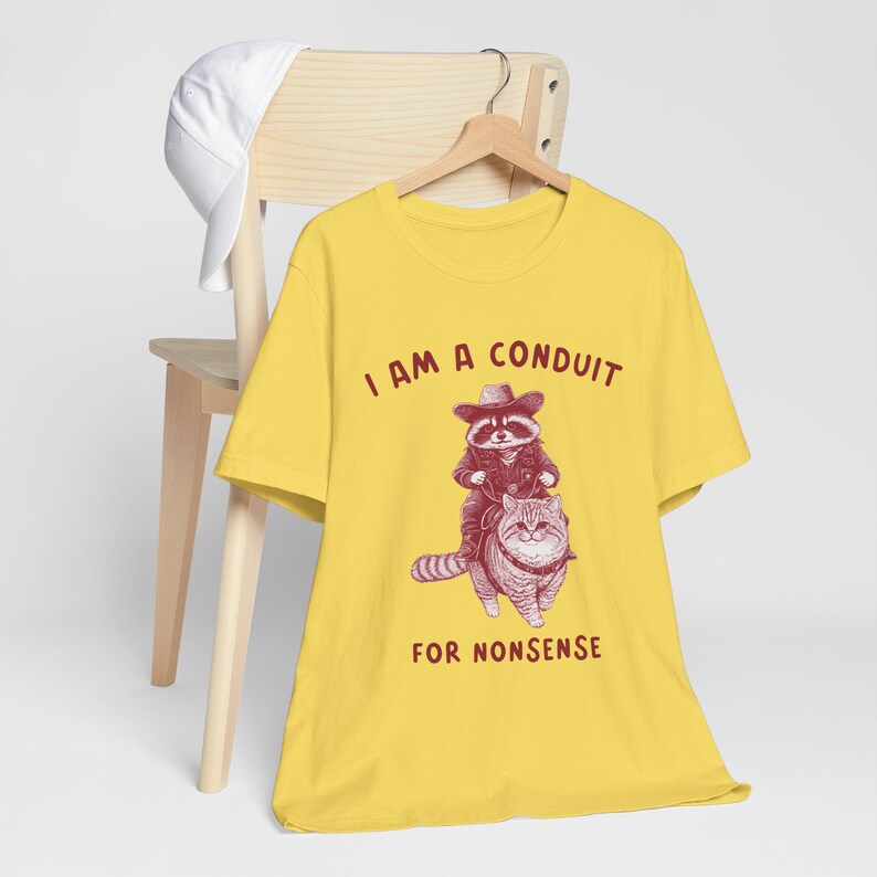 Funny Raccoon Cowboy Riding Cat T-Shirt, I Am a Conduit for Nonsense Shirt, Quirky Graphic Tee, Retro Animal Humor Shirt, Cowboy Cat Tee image 3