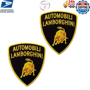 Puede incluir: Dos parches bordados en negro y amarillo con el logotipo de Lamborghini. Los parches tienen forma de escudo con las palabras "AUTOMOBILI LAMBORGHINI" en amarillo y un emblema de toro dorado. Los parches son nuevos.