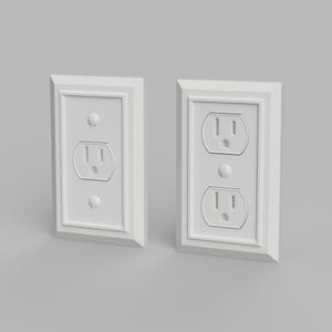 May include: Two white electrical outlet covers with a rectangular frame and a decorative border. Each cover has a standard two-socket outlet and two small circular holes. The outlets are set against a light grey background.