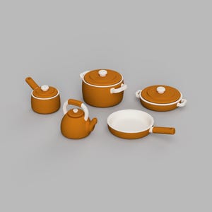 May include: A set of five kitchen cookware items in a matte ochre orange finish with white accents. The collection includes a lidded stockpot, a lidded saucepan, a lidded casserole dish, a tea kettle, and an open frying pan with a long handle.