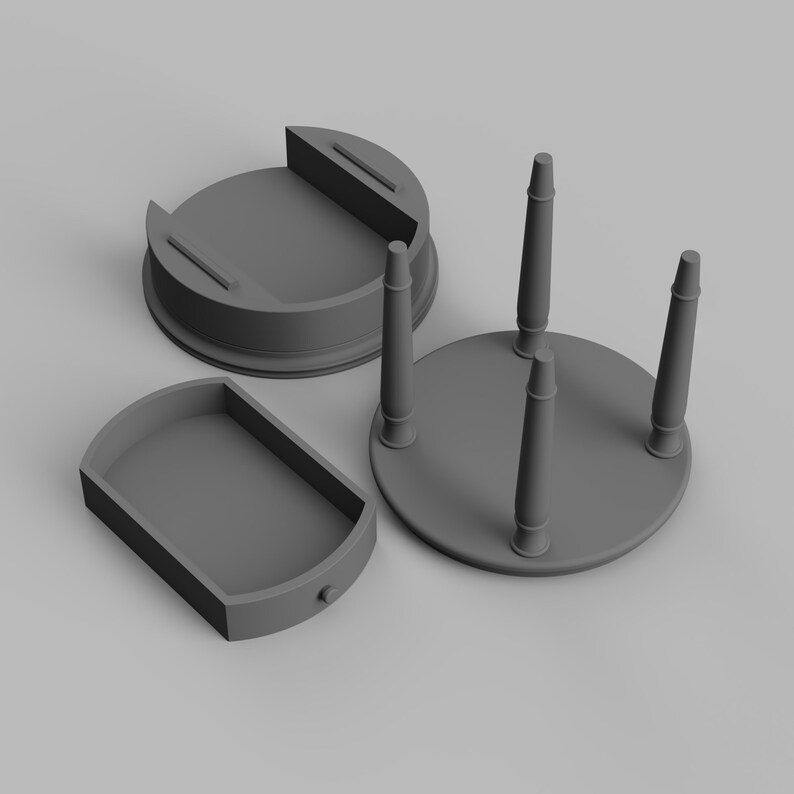 May include: A disassembled gray wooden table with three legs and a round top. The table is shown in three pieces: the top, the base, and the drawer.