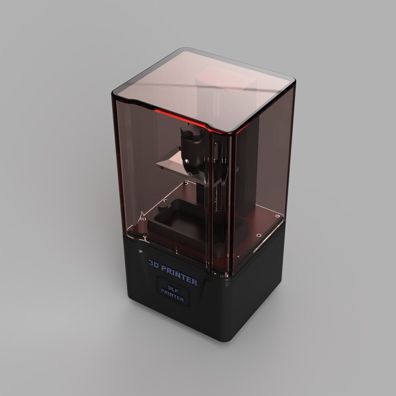 May include: A black and red 3D printer with a clear plastic cover. The printer has a label that says "3D PRINTER" and "DLP PRINTER".