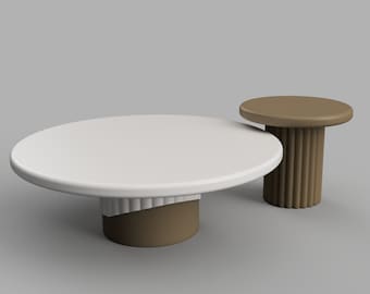 May include: Two round tables with white tops and brown bases. The larger table has a wavy, fluted base. The smaller table has a smooth, cylindrical base.