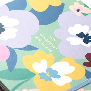 May include: A green floral patterned notebook with the text "Very Important Birthdays" in yellow letters.