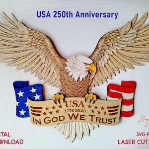 May include: Wooden laser-cut eagle with outstretched wings, a banner reading "USA IN GOD WE TRUST," and American flag elements. The design commemorates the USA's 250th anniversary, with the years 1776-2026. The image also includes the text "DIGITAL DOWNLOAD."