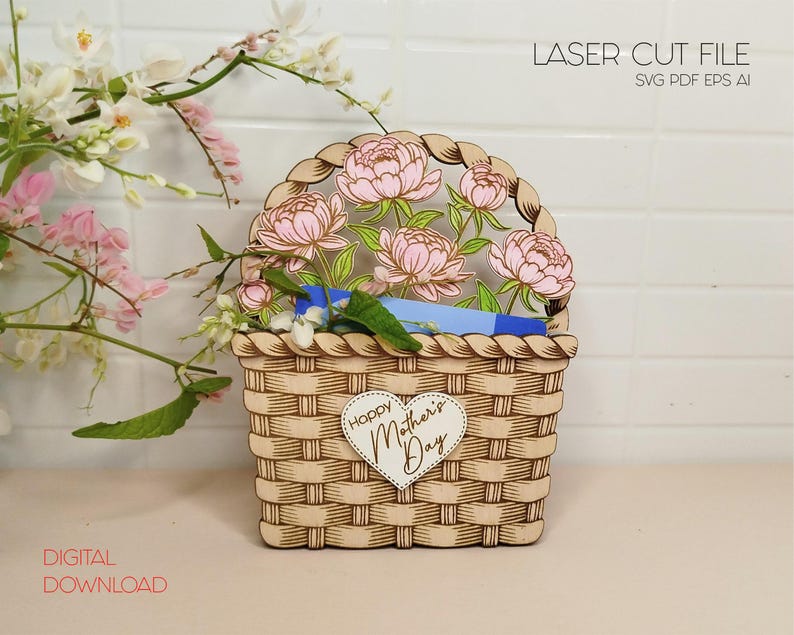 以下が含まれることがあります： 花と「Happy Mother's Day」のハートが付いた木製のバスケットのレーザーカットファイル。ファイルはSVG、PDF、EPS、AI形式で入手できます。