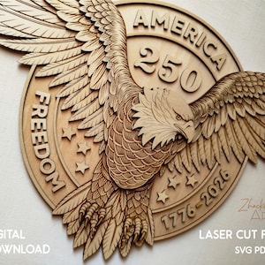 Laser-cut wooden wall art featuring an eagle with outstretched wings, the word "FREEDOM", and the text "AMERICA 250 1776-2026". The design includes stars and is a digital download.