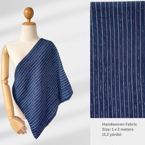 May include: Handwoven fabric in a blue and white striped pattern. The fabric is displayed on a mannequin and is 1 x 2 meters (2.2 yards) in size.