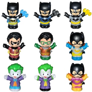 May include: Nine colorful toy figures of Batman, Robin, and the Joker. Each figure has a unique design, with Batman in various suits, Robin in red and yellow, and the Joker in purple and green. The toys are designed for children.