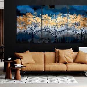 a living room with a couch and a painting on the wall