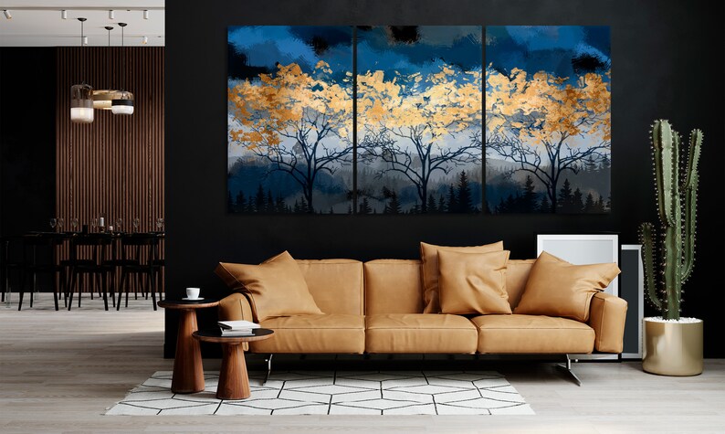 a living room with a couch and a painting on the wall