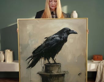 May include: A framed painting featuring a large black raven perched on a weathered post. The artwork has a neutral color palette with a gold frame. The raven is the focal point, rendered with detailed brushstrokes.